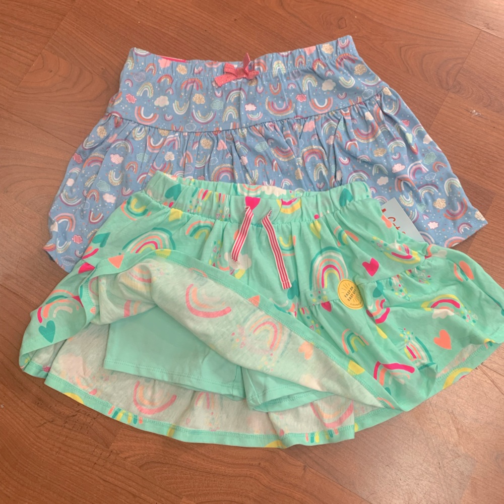 Girls 2 NWT 7/8 Skorts. Both different rainbow prints